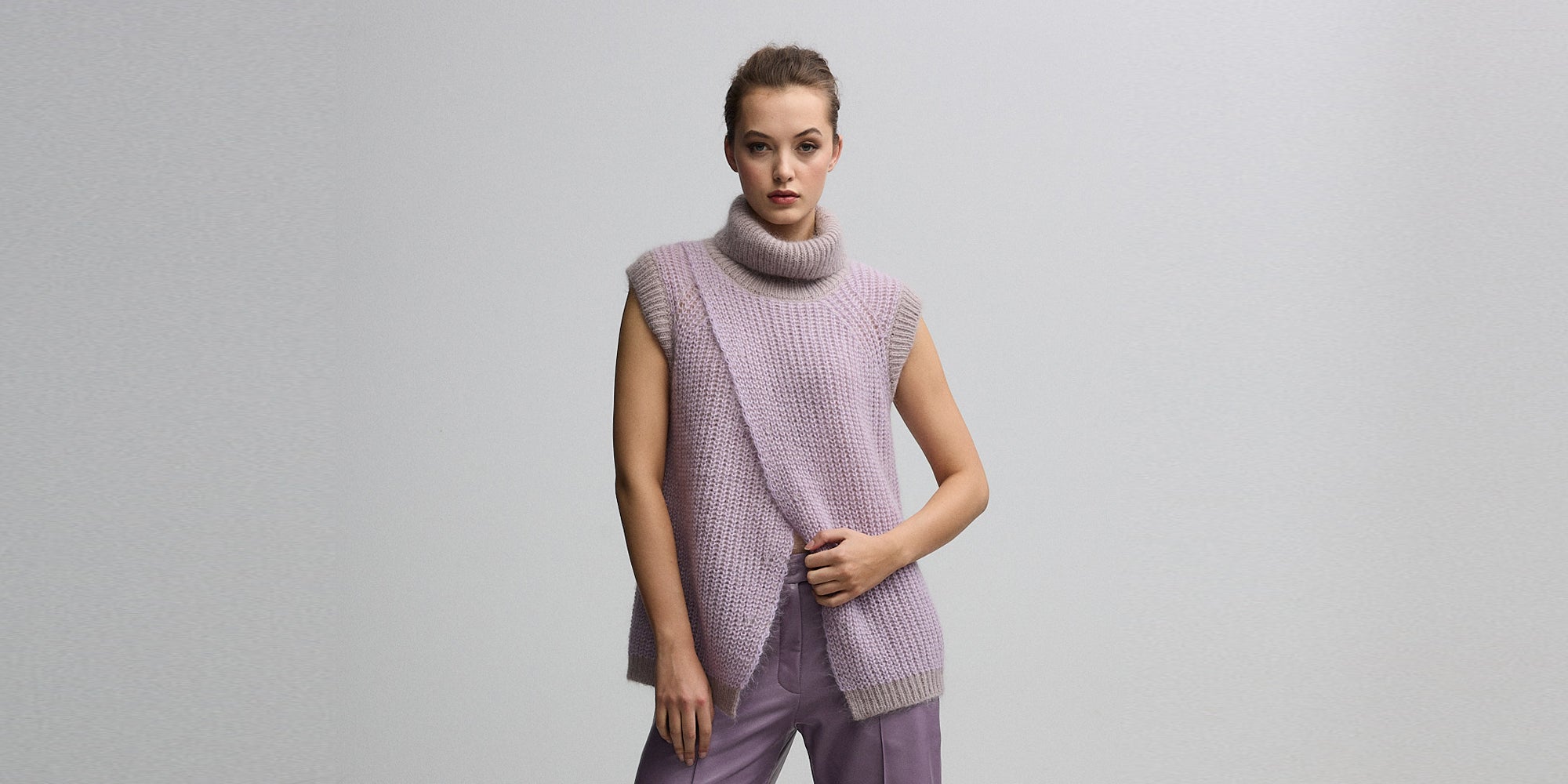 Lilac knit and vest. Leather pants.